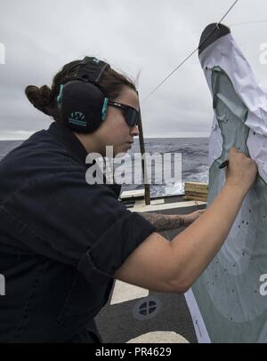 ATLANTIC OCEAN (Sept. 8, 2018) Sonar Technician (Surface) 3rd Class Ashley Holt scores a live-fire qualification exercise the guided-missile destroyer USS Forrest Sherman (DDG 98). Forrest Sherman is currently deployed as part of the Harry S. Truman Carrier Strike Group. Harry S. Truman will continue its deployment by conducting sustainment operations in the Atlantic. Stock Photo