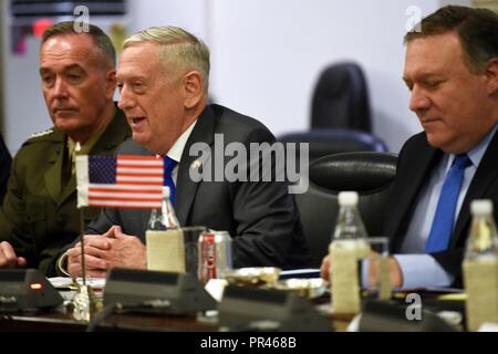 The chairman of the Joint Chiefs of Staff, Marine Corps Gen. Joseph F. Dunford, U.S. Secretary of Defense James N. Mattis and U.S. Secretary of State Michael Pompeo take part in the first-ever U.S.-India 2+2 ministerial dialogue, at the Ministry of Foreign Affairs Jawaharlal Nehru Bhawan, New Delhi, India, Sept. 6, 2018. The leaders re-affirmed the commitment to enhancing the U.S.-India relationship. Stock Photo