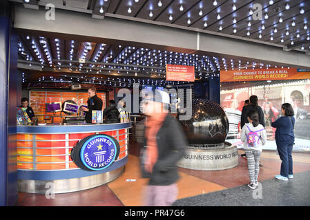 Los Angeles, CA - March 20, 2018: Tourists walking in front of the Guinness World Records building Stock Photo