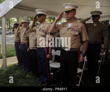 (From right) Maj. Gen. James Bierman Jr., Sergeant Maj. Mike Lanpolsaen, Brigadier Gen. William Seely III, Col. William Gray and Sergeant Maj. Cortez Brown salute during the National Anthem at the ribbon-cutting ceremony of Marine Corps Recruiting Station Charlotte, North Carolina during United States Marine Corps’ 2018 Marine Week in Charlotte, September 5, 2018. The station is a part of 6th Marine Corps District, a unit committed to strengthening bonds between the Marine Corps and the citizens of the Southeastern United States with a goal to make Marines who are capable of winning the nation Stock Photo