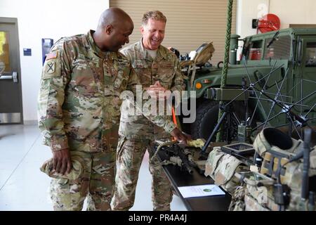 U.S. Army Brig. Gen. Jemal J. Beale, The Adjutant General of New Jersey, and Command Sgt. Maj. Earnest Williams, State Command Sgt. Maj. of the NJ Army National Guard, visit the 177th Fighter Wing, New Jersey Air National Guard, Sep. 6, 2018, in Egg Harbor Twp., N.J. Their visit included stops at the 227th Air Support Operations Squadron, 177th Fire Department, Maintenance Group and Operations Group, along with tours of the 177 FW Aerospace Control Alert facility and Explosive Ordnance Disposal shop. Stock Photo