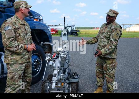 U.S. Army Brig. Gen. Jemal J. Beale, The Adjutant General of New Jersey, and Command Sgt. Maj. Earnest Williams, State Command Sgt. Maj. of the NJ Army National Guard, visit the 177th Fighter Wing, New Jersey Air National Guard, Sep. 6, 2018, in Egg Harbor Twp., N.J. Their visit included stops at the 227th Air Support Operations Squadron, 177th Fire Department, Maintenance Group and Operations Group, along with tours of the 177 FW Aerospace Control Alert facility and Explosive Ordnance Disposal shop. Stock Photo