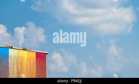 The colored facade in front of the blue sky in 16 x 9 Stock Photo