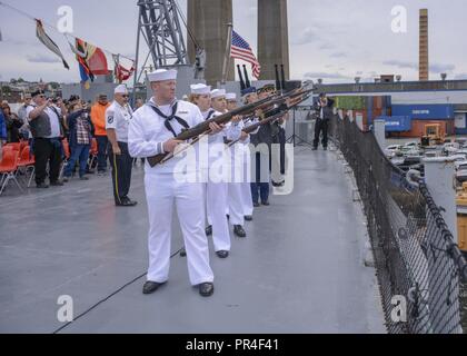 RIVER, Mass. (Sept. 9, 2018) Sailors assigned to USS Constitution and members of the American Legion perform a ceremonial gun volley during a POW/MIA ceremony on the decommissioned South Dakota-class battleship USS Massachusetts (BB 59). Sept. 15 marks National POW/MIA recognition day in the U.S. Stock Photo