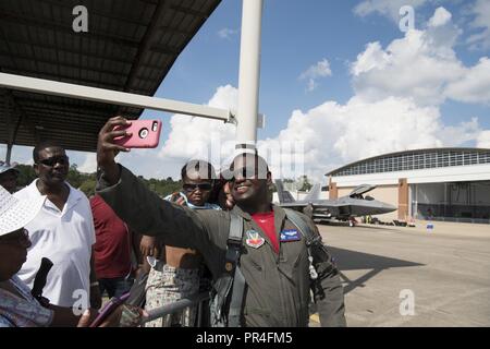 Maj Paul 'Loco' Lopez, F-22 pilot and commander of the ACC F-22 Demonstration Team, takes a selfie with fans at the Red Tails Over Montgomery Air Show Sept. 8, 2018 at Dannelly Field, Ala. The air show was the first of its size at Dannelly Field, with more than 3 hours of flying demonstrations. Stock Photo