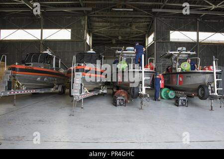 Coast Guard Aids to Navigation Team Georgetown crew members prepare assets Sept. 13, 2018, at Joint Base Charleston in Charleston, S.C. Coast Guard crews from across the U.S. are strategically relocating personnel and assets for Hurricane Florence post-storm response. Stock Photo