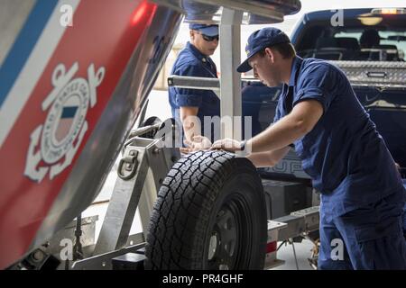 Coast Guard Aids to Navigation Team Georgetown crew members prepare assets Sept. 13, 2018, at Joint Base Charleston in Charleston, S.C. Coast Guard crews from across the U.S. are strategically relocating personnel and assets for Hurricane Florence post-storm response. Stock Photo