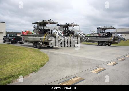 Coast Guard Aids to Navigation Team Georgetown crew members prepare trailered assets Sept. 13, 2018, at Joint Base Charleston in Charleston, S.C. Coast Guard crews from across the U.S. are strategically relocating personnel and assets for Hurricane Florence post-storm response. Stock Photo