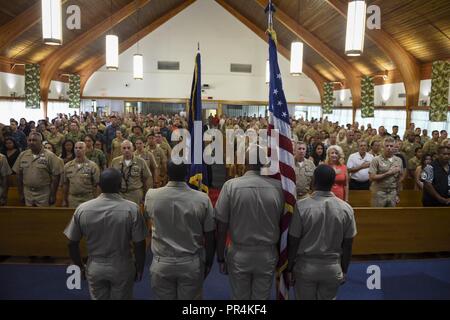 PEARL HARBOR (Sept. 14, 2018)  The color guard presents colors during a chief petty officer pinning ceremony at the Hickam Chapel on Joint Base Pearl Harbor-Hickam, Sept. 14. The ceremony recognized 20 newly-pinned chiefs assigned to the Hawaii region. Stock Photo