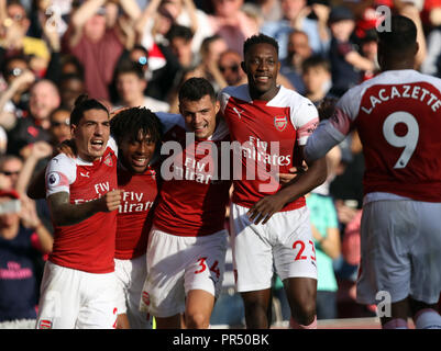 London, UK. September 29, 2018. Hector Bellerin (A), Alex Iwobi (A), Granit Xhaka (A) and Danny Welbeck (A) wait to congratulate Alexandre Lacazette (A) after he scored the first Arsenal goal (1-0) at the English Premier League game between Arsenal and Watford at The Emirates Stadium, London, on September 29, 2018. **This picture is for editorial use only** Credit: Paul Marriott/Alamy Live News