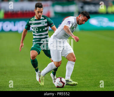 BUDAPEST, HUNGARY - JULY 12: (r-l) Roland Varga of Ferencvarosi TC hugs  goal scorer Stefan