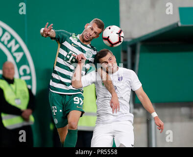 BUDAPEST, HUNGARY - JUNE 20: (r-l) Isael da Silva Barbosa of Ferencvarosi TC  challenges Dzenan Burekovic of Ujpest FC during the Hungarian OTP Bank Liga  match between Ferencvarosi TC and Ujpest FC