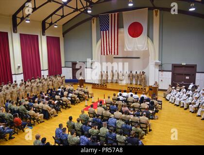 YOKOSUKA, Japan (Sept. 14, 2018) Newly appointed chief petty officers stand at attention before being pinned with their anchors during the 2018 USS Blue Ridge (LCC 19) and U.S. 7th Fleet Chief Petty Officer Pinning ceremony at Commander, Fleet Activities Yokosuka. A total of 13 Sailors were promoted to the rank of chief petty officer during the ceremony. Stock Photo