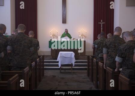 Rear Adm. Gregory Todd, the current Chaplain of the Marine Corps, Deputy Chief of Chaplains, Deputy Director of Religious Ministries gives a sermon to recruits with India Company, 3rd Recruit Training Battalion during a chapel service at Marine Corps Base Marine Corps Recruit Depot San Diego, Sept. 9, 2018. Todd assumed his current duties as the 20th Chaplain of the United States Marine Corps in June 2018. Stock Photo