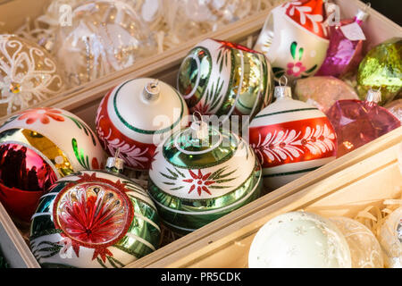 Christmas ornaments. Christmas market store - Christmas decorations in wooden boxes. Stock Photo