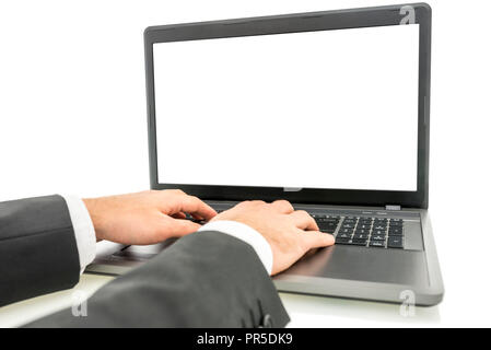 Closeup of businessman hands typing on laptop computer. White empty screen ready for your text. Stock Photo