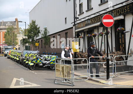 London, UK - August 27, 2018: Police officers and motorcycles were waiting by for permission to go Stock Photo