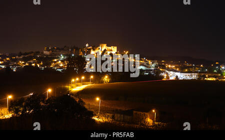 Image taken at night depicting the main road leading into the town of Montemor-o-Velho with it’s impressive Castle and Churches Stock Photo