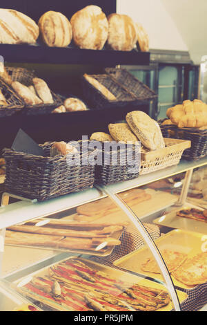 Modern spanish  bakery with different kinds of bread, cakes and buns