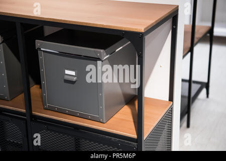 Decorative storage cardbox on the shelf at home Stock Photo