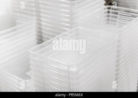 Folded transparent plastic containers boxes at store Stock Photo