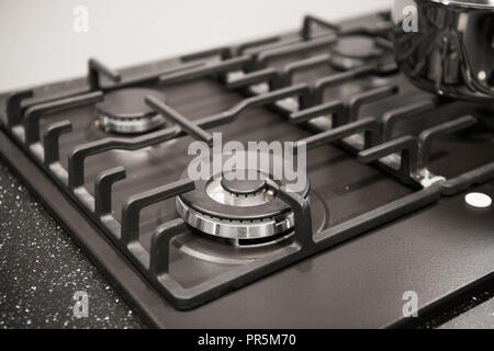 closeup of brand new, modern gas stove on countertop in contemporary modern home kitchen. Stock Photo