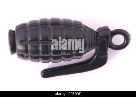 Black plastic toy grenade on a white background Stock Photo