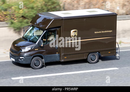 UPS delivery van on motorway. UPS is the world's largest package delivery company and a provider of supply chain management solutions. Stock Photo