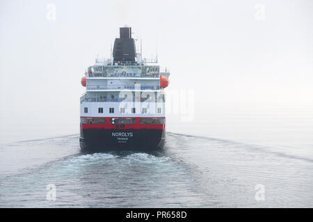 The Hurtigruten Ferry, MS NORDLYS, Departing From Harstad, In A Thick Sea Fog. Troms County, Norway. Stock Photo