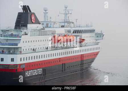 The Hurtigruten Ship, MS NORDLYS, Departing From Harstad, In A Thick Morning Sea Fog. Troms County, Norway. Stock Photo