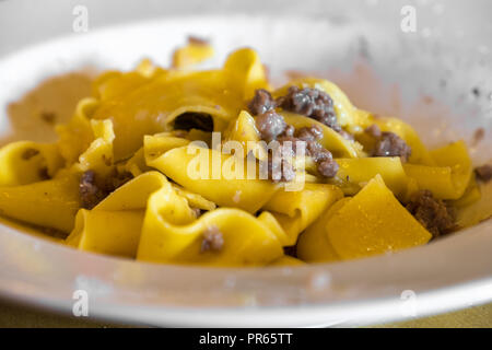 egg pasta tagliatelle with sausage meat - traditional Emilia Romagna region italian food Stock Photo