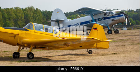 Gifhorn, Germany, September 16, 2018: A white and a yellow historical small airplane on the airfield of the glider airfield of Wilsche near Gifhorn Stock Photo