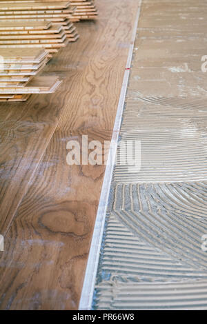 Stack of laminated wooden flooring boards arranged Stock Photo