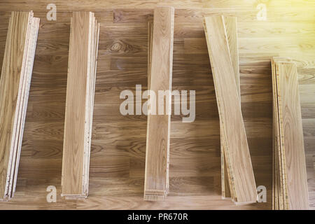 Stack of laminated wooden flooring boards arranged Stock Photo
