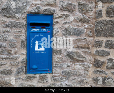 Blue post box on Lundy island which has its own postal service Stock Photo