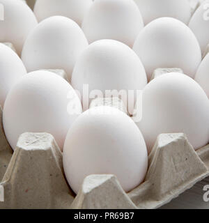 Chicken eggs in egg box, closeup. Stock Photo
