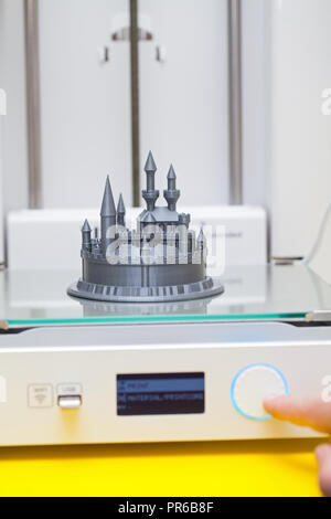 White 3D printer during work. Plastic castle - disney figure almoust done Stock Photo