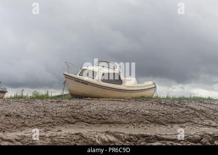 Small boat on marshland, Heswall, Wirral, UK. Stock Photo