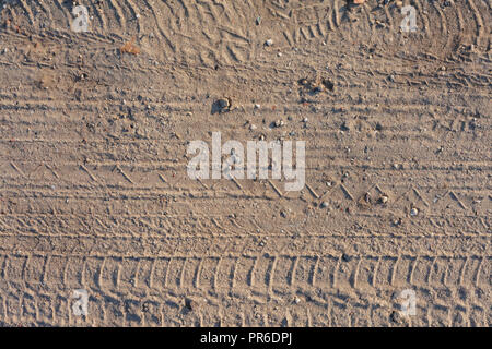 seamless dirt road texture background. Tracks of cars on the sand in the desert sand Stock Photo