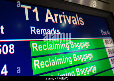 Reclaiming Baggage information sign in the Arrival Hall at Manchester International Airport, UK Stock Photo