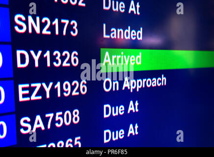 Flight Arrived information on sign at the Arrival Hall in Manchester Airport, UK Stock Photo