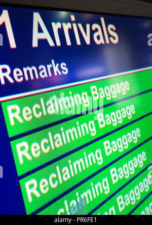 Reclaiming Baggage information sign in the Arrival Hall at Manchester International Airport, UK Stock Photo
