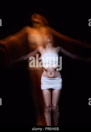 Horror shot: soul is leaving body of a young girl Stock Photo