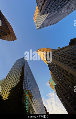 Four offices skyscrapers standing on blue sky Stock Photo