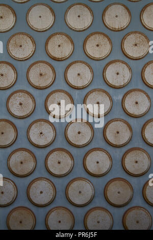 Discs on a wall Stock Photo