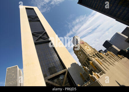 Art Deco building surrounded by modern skyscrapers NYC USA Stock Photo