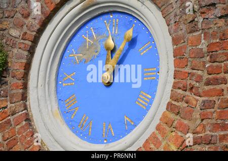 Wall Clock on Red Brick Building Stock Photo