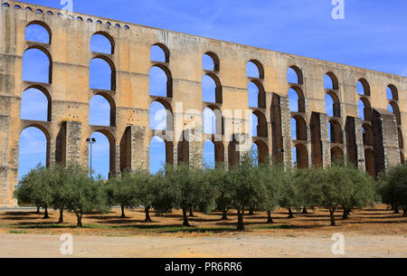 Portugal, Alentejo region, Elvas. The 16th Century Amoreira Aqueduct with an olive grove in the foreground. Elvas is a UNESCO World Heritage site. Stock Photo