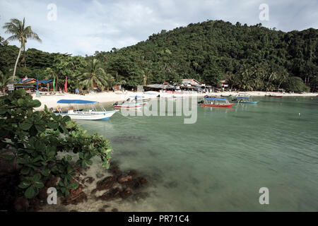 Tourist boats at Senja Bay beach in the Perhentian Islands, Malaysia Stock Photo