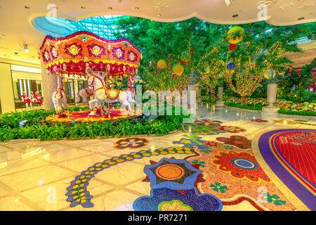 Las Vegas, Nevada, USA - August 18, 2018: animated flowers carousel in the lobby at Wynn Hotel Casino Resort, Las Vegas Strip. Preston Bailey's floral installation is made up of thousands of flowers. Stock Photo